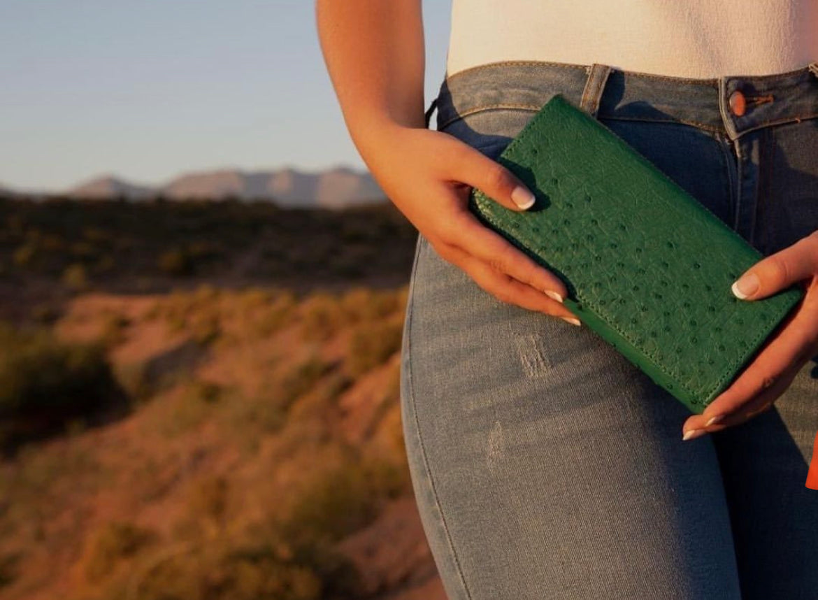 A lady carrying an ostrich purse